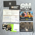 Lot Of Paperwork / Instruction Manuals Olympus OM-1 Zuiko Lenses. Fixed Price $13.20.