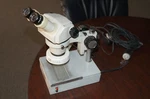 Nikon SMZ-1B Stereoscopic Zoom Microscope With Lighted Base And Ring. Fixed Price $650.00.
