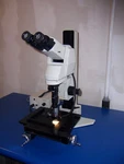 9813 Olympus U-ebti Microscope W/ Ergo Head & Navitar Zoom Mitutoyo 5X Lens. Fixed Price $3000.00.