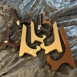 Lot Of 8 Gold Brown Wood Plate Stands 4-10 Tall. Fixed Price $18.00.