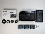 Fujifilm X-pro 1 Camera W/ Grip, Diopter, Batteries, 32GB Sd And Thumb. Fixed Price $600.00.