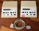 One Pair Wild Photoautomat MPS46 Microscope Camera Controllers And 15-PIN Cable. Fixed Price $75.00.