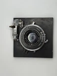 135MM F/4.7 Raptar W/wollensak Rapax Synchromatic Read. Fixed Price $60.00.